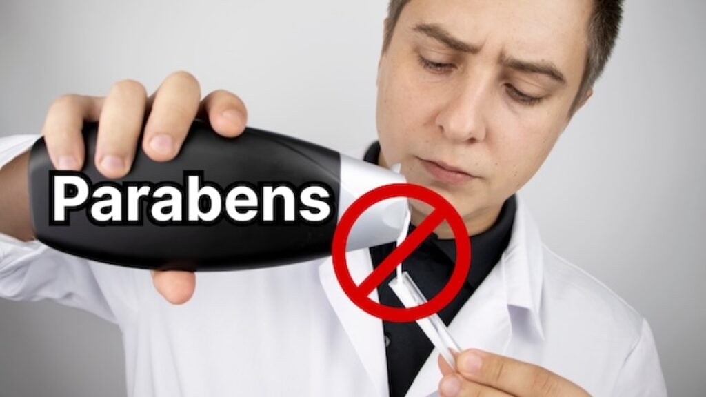 Scientist pouring Parabens into vial